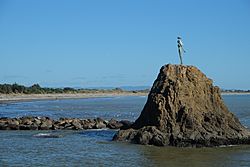 'The Lady on the Rock' statue of Wairaka atop Turuturu Rock at the mouth of the Whakatane River.jpg