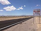 2014-07-18 13 11 09 Sign for and view of Rachel, Nevada from northbound Nevada State Route 375 about 38.5 miles north of Nevada State Route 318.JPG