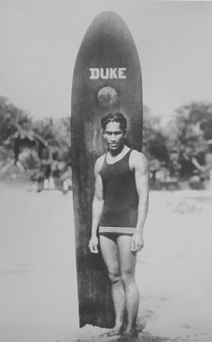 Anonymous photograph of Duke Paoa Kahanamoku with his surfboard.JPG