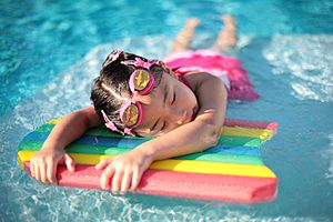 Girl with swimming board