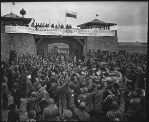 Liberated prisoners in the Mauthausen concentration camp near Linz, Austria, give rousing welcome to Cavalrymen of... - NARA - 531293