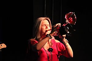 Young woman playing a flumpet – a hybrid of a trumpet and a flugelhorn