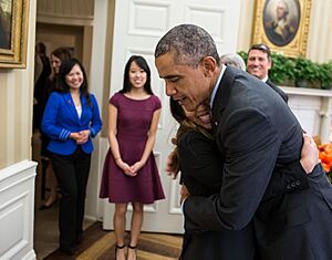 Barack Obama hugs Nina Pham, a Dallas nurse who survived Ebola, 2014