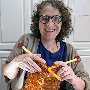 Carol Milne knitting glass.jpg