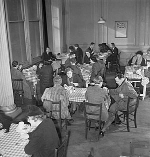 Members of the public enjoying a meal in one of the chain of British Restaurants established during the Second World War, London, 1943. D12268