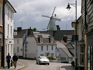 White windmill and white wooden houses in Cranbrook