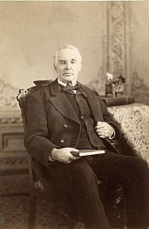Photo of Elias Smith sitting in chair.