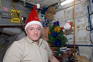 ISS-26 Scott Kelly with Santa Claus hat