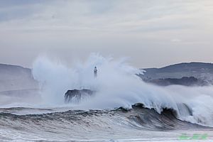 Isla de Mouro, waves crashing over lighthouse