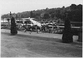 Lake Washington Ship Canal, U.S. Government Locks, Seattle, Washington. B-29 on barge being lowered in the large... - NARA - 298878