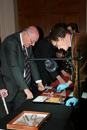 Lord Renfrew is shown the Roman gold coins from near St Albans by Sam Moorhead (8241370038)