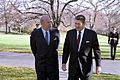 President Ronald Reagan walking with George Shultz outside the Oval Office