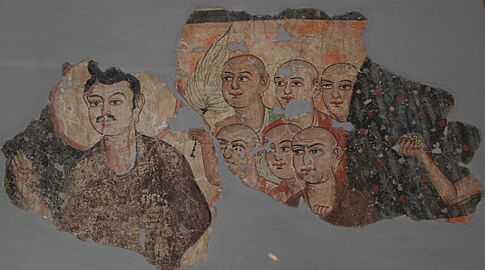 Buddha with his disciples, wall painting from a stupa in China displayed at National Museum, New Delhi 