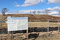 EPA Superfund Signage at the Clearview Landfill with covered landfill in background