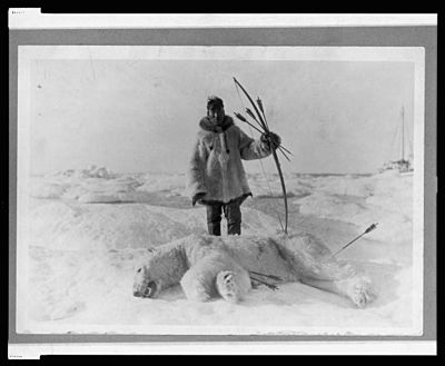 Eskimo hunter and polar bear slain with bow and arrow