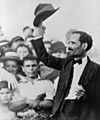 Pedro Albizu Campos raising his hat to a crowd, 1936