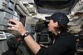 STS-125 Megan McArthur works with the controls of the remote manipulator system