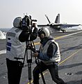 US Navy 101129-N-7103C-162 Reporters from Korean news media capture footage of an F-A-18E Super Hornet assigned to the Eagles of Strike Fighter Squ