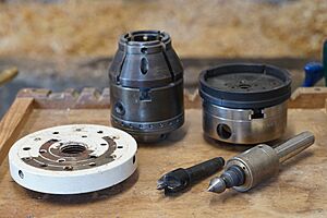 Woodturning, work holding devices