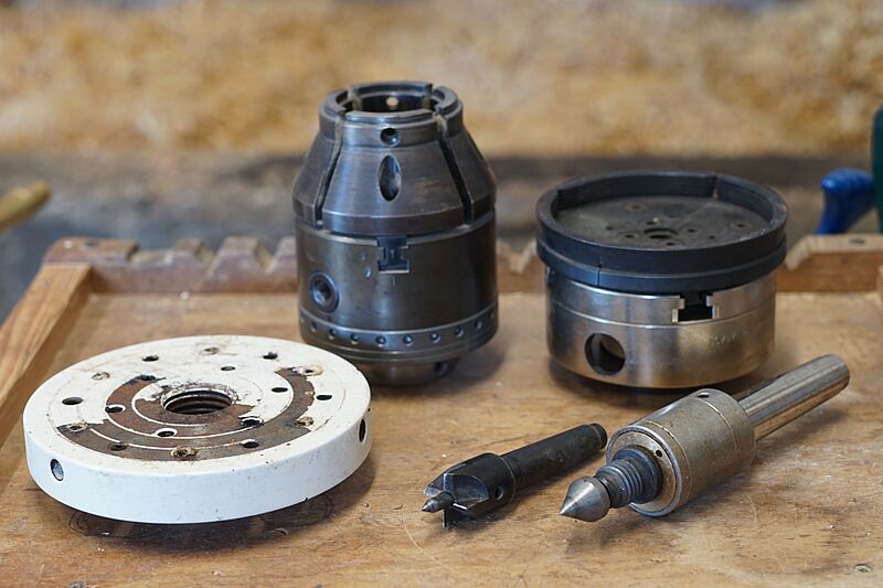 Woodturning, work holding devices