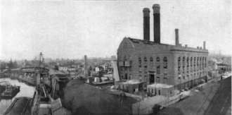 Black and white photograph of the building and the Gowanus Canal