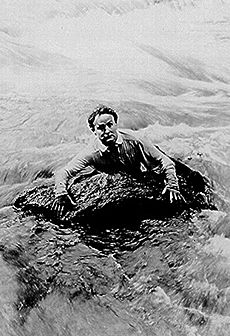 Houdini swims river in scene from The man from beyond (cropped)
