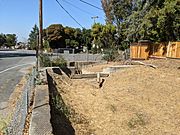 Miguelita Creek goes under Fairway Drive
