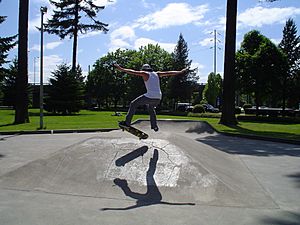 Teen male skater in Salem Oregon park jump