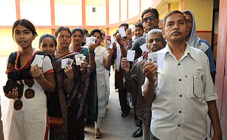 Voters standing in the queue to cast their votes, at a polling booth, during the 9th Phase of General Elections-2014, in Varanasi, Uttar Pradesh on May 12, 2014