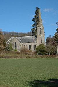 A stone church seen from the north.  On the right is a narrow tower and spire, and projecting from the centre is the transept, all with lancet windows