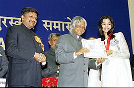 The President Dr. A.P.J. Abdul Kalam presenting the Best Female Playback Singer Award for the year 2002 to Shreya Ghoshal for her soulful rendering of the song 'Bairi Piya' for the film Devdas