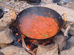 Qalayet Bandora cooked over a campfire in Wadi Mukheiris, near the Jordanian coast of the Dead Sea.