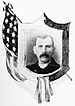 Head of a white man with mustache and short hair wearing a dark jacket. Around the portrait is a shield-shaped frame and a depiction of an American flag.