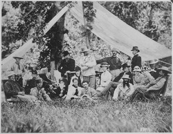 Hunting and camping party of Custer (standing in center) and invited guests. Fort A. Lincoln on the Little Heart River, - NARA - 530885