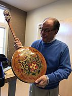 Johnny Baier holding Gibson Florentine banjo