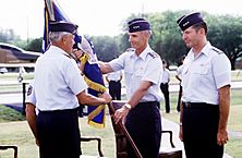 Lieutenant General Merrill McPeak passes the unit colors of the 12th Air Force to General Robert D. Russ