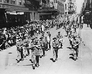 Members of the 2-19 Battalion marching down Castlereagh Street near the corner of Hunter Street in Sydney CBD during September 1940