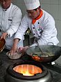 Wok cooking and the heat source by The Pocket in Nanjing