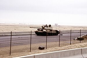 An abandoned Iraqi Type 69 tank on the road into Kuwait City during the Gulf War