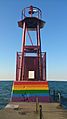 Beacon at Kathy Osterman beach with rainbow flag