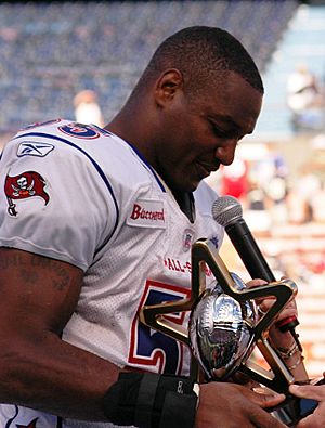 Derrick Brooks with 2006 Pro Bowl MVP trophy 060210-N-4856G-129