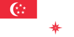 A red rectangle at the top left corner of the flag, charged with a white crescent and five white stars arranged in a pentagon. The rest of the flag is coloured white. At the bottom right part of the flag is an eight pointed star that is red.