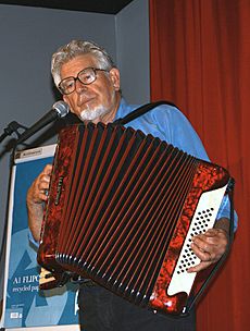 Rolf Harris playing the accordion