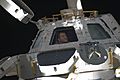 STS-130 Nicholas Patrick looks through Cupola