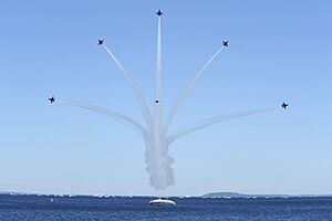 US Navy 100703-N-0092J-198 Pilots assigned to the U.S. Navy flight demonstration squadron, the Blue Angels, perform the low break cross maneuver during the National Cherry Festival Air Show