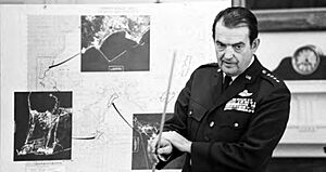 General David Jones showing the Cambodia Aerial Photograph during The National Security Council at the Mayaguez Incident
