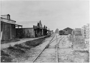 Main street and railway station at Kaihu, Northland region ATLIB 337866