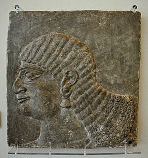 Head of a royal attendant. From the North-West Palace at Nimrud, Iraq. Reign of Ashurnasirpall II, 883-859 BCE. The Burrell Collection, Glasgow, UK