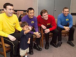 Four of the original Wiggles and a fan in 2004. (L–R: Greg Page, Jeff Fatt, Murray Cook, and Anthony Field)
