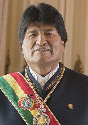 Morales by a Bolivian flag